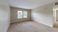 Located at 1085 Hearn St in Rock Hill, SC, this single-story, three-bedroom, one-bathroom home offers a practical and comfortable layout. The living room serves as the welcoming heart of the home, featuring soft carpet flooring, a ceiling fan with light fixture, and a front entry door that brings in natural light. The kitchen stands out with updated grey shaker-style cabinetry, granite countertops, a stainless steel sink, a dishwasher, and light hardwood-style flooring — a functional and modern space for cooking and meal prep. The primary bedroom is a generously sized retreat, complete with a ceiling fan, a closet, and windows overlooking the outdoors. The two additional bedrooms are each carpeted and filled with natural light from large windows fitted with blinds, offering views of the surrounding greenery. Closet storage is available in multiple bedrooms. The full bathroom features a tiled tub-shower combination with chrome fixtures. Hallways connect the rooms efficiently throughout the single floor. Neutral tones and consistent finishes create a cohesive, move-in-ready atmosphere throughout the entire home.