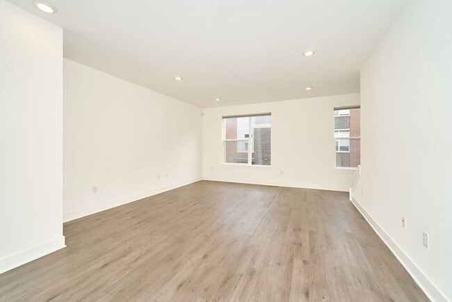 Building Photo - Like New Townhome With Your Own Rooftop Views of Downtown Indy!