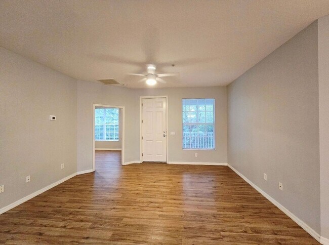 Building Photo - Annual 2/2 Condo with Flex Room in River Preserve Featuring Community Pool