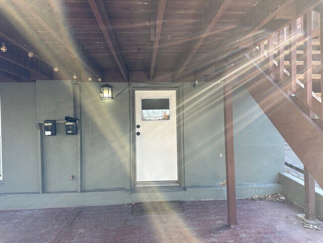 Under the deck is the nice entrance to the apartment. - 332 S Elizabeth St