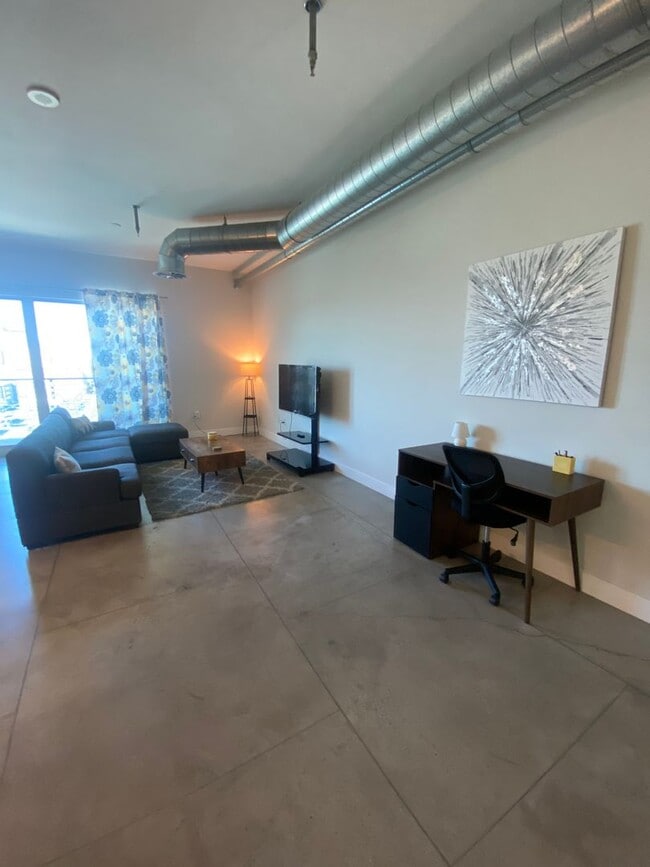 Building Photo - Stunning Fully Furnished Loft with Breatht...