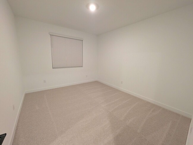 Large 13' x 11' bedroom with carpeted floor - 628 S Cecita Wy