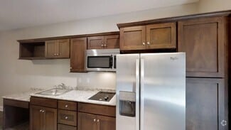 One bedroom suite kitchen - Eagle Village