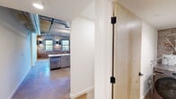 Located at 1925 Myrtle St in Chattanooga, TN, this two-story industrial loft masterfully blends historic character with contemporary design. The main floor opens into a spacious living area and kitchen, anchored by striking exposed brick walls, polished concrete floors, and soaring ceilings with visible ductwork that celebrate the building's industrial heritage. Multiple windows along the brick walls flood the space with natural light.

The kitchen is well-appointed with grey cabinetry, a white quartz countertop featuring an undermount sink, a sleek blue-grey tile backsplash, and a full suite of stainless steel appliances including a range, over-the-range microwave, dishwasher, and French door refrigerator. Pendant lighting adds a modern industrial touch above the kitchen peninsula.

A staircase with a black metal railing leads to the upper floor, where the bedroom is situated. The bedroom features light wood-tone flooring, an exposed beam ceiling with a ceiling fan, and direct access to the bathroom. The bathroom is clean and modern, with large-format tile, a glass-enclosed walk-in shower with black hardware, a white vanity, and a framed mirror. A dedicated closet completes the upper level, offering a well-organized and private retreat.