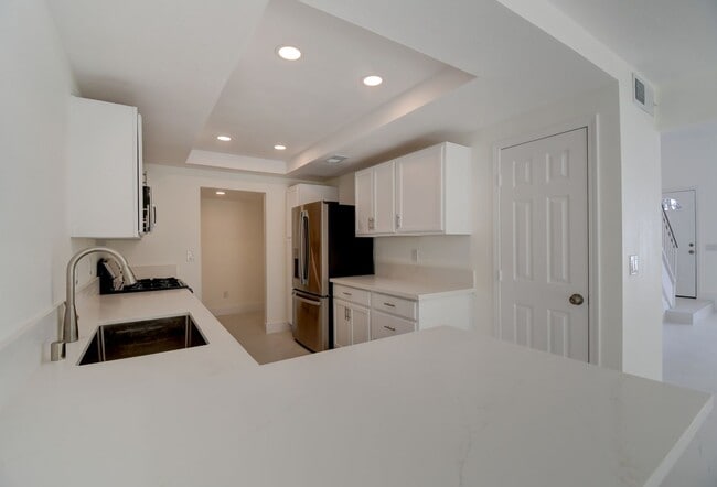 Building Photo - Beautifully renovated two-story home tucked inside a quiet, tree-lined community in the heart of ...