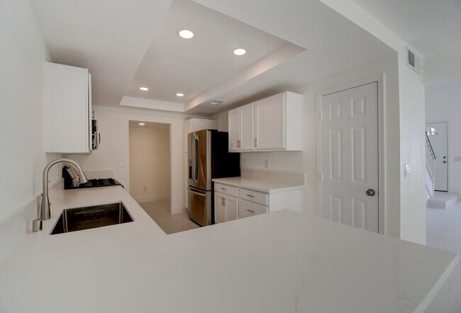 Building Photo - Beautifully renovated two-story home tucked inside a quiet, tree-lined community in the heart of ...
