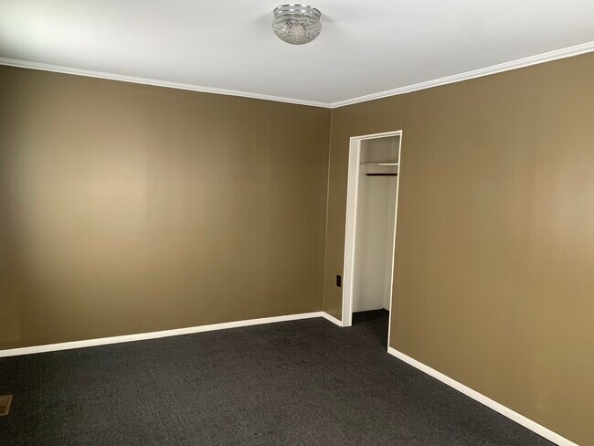 Bedroom looking at closet - 7504 NY-177