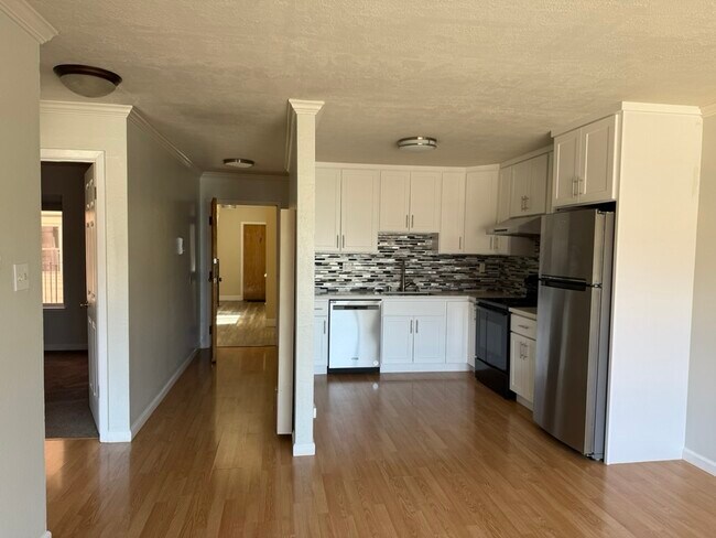 Kitchen view from living room - 409 Kirkham St Apartments