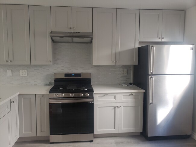 Plenty of cabinets, new range - 1830 Colby Ave