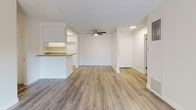 Located at 3350 Topaz Ln in Fullerton, CA, this single-story unit offers a clean, well-maintained interior with a thoughtfully designed open layout. The living area features light wood-style flooring and a ceiling fan, creating a comfortable and airy atmosphere. A pass-through counter connects the living space to the kitchen, which is outfitted with white cabinetry, speckled stone-style countertops, a gas range, double sink, and ample storage. Natural light filters throughout the unit, enhancing the bright, neutral color palette found in every room.

The bedrooms are carpeted and generously sized, each featuring vertical blinds over windows that allow for adjustable natural light. One bedroom includes dual closets flanking a hallway entrance, providing notable storage capacity. The unit includes two bathrooms, each featuring white vanity cabinetry, speckled countertops, large mirrors, and a tub-shower combination with sliding glass doors. Wood-style flooring extends through the bathrooms and connecting hallways, providing a cohesive look. Textured ceilings, clean white walls, and consistent finishes throughout contribute to the overall polished and functional character of the space.