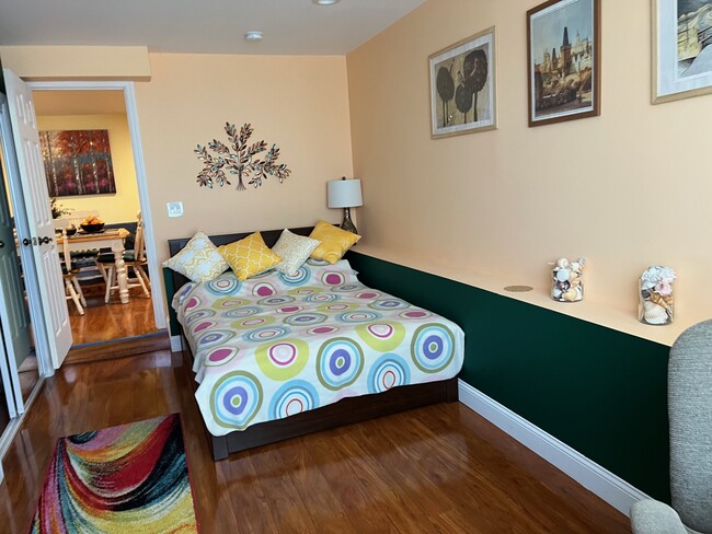 Bedroom 1 - full size bed, upholstered convertible chair-bed, desk, desk chair, large closet - 1627 15th Ave