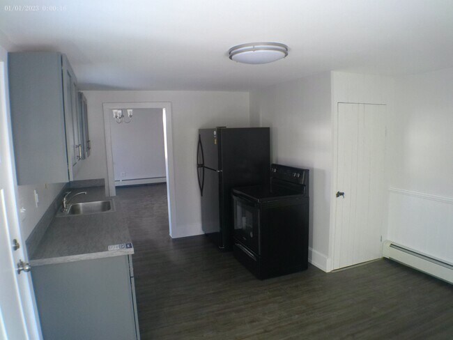 Kitchen with storage available in basement. - 35 Main St