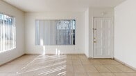Located at 20557 Osage Ave in Torrance, California, this single-floor residence offers a clean, functional layout across several well-defined living spaces. The bright living area features light-toned ceramic tile flooring, white walls, and a textured ceiling, with large windows dressed in vertical blinds that invite natural light throughout the day. A front entry door with sidelights enhances the welcoming atmosphere of the main living space.

The kitchen is equipped with white cabinetry, a granite-toned countertop, a built-in microwave, electric range, dishwasher, and a sink positioned beneath a window — all finished with matching light tile flooring and a ceiling fan for added comfort.

The bedrooms are carpeted and offer a cozy, quiet feel. One bedroom features a mirrored sliding closet door, while another offers a wide window with views of palm trees and the surrounding Torrance neighborhood, providing a pleasant outdoor connection. Both rooms feature textured ceilings and ceiling fans.

Two full bathrooms serve the residence — one with a walk-in shower and a vanity with a granite-style countertop, and another with a full tub-shower combination, toilet, and matching vanity. Both bathrooms are finished with light ceramic tile flooring, maintaining a consistent and cohesive aesthetic throughout the home.