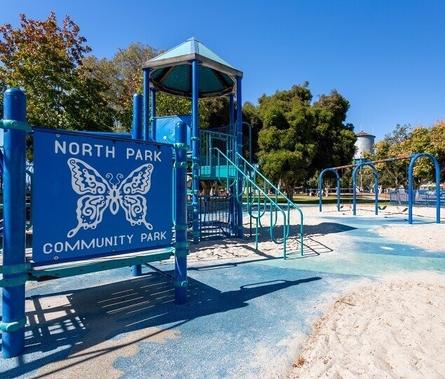 North Park Community Park offers a lively playground, walking trails, and a tennis court