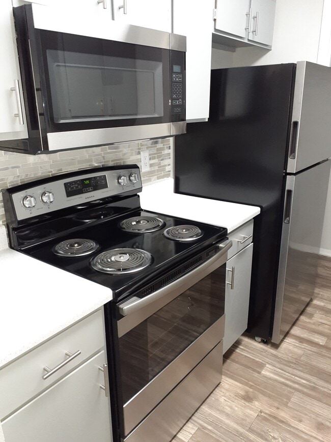 Stainless & Black Appliance Package in all Kitchens - City Pines Apartment Homes