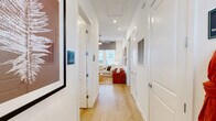 This contemporary 950 square foot apartment in Charlotte, NC offers a harmonious blend of style and functionality. The open-concept floor plan seamlessly integrates the living room and kitchen, creating an inviting space for both relaxation and entertainment. The gourmet kitchen boasts pristine white cabinetry, stainless steel appliances, and a spacious island with seating, perfect for casual dining or food preparation.

The apartment features two well-appointed bedrooms, including a primary suite of 160 square feet. Each bedroom is thoughtfully designed with ample closet space and large windows that flood the rooms with natural light. The three luxurious bathrooms are finished with modern fixtures and sleek surfaces, providing both comfort and elegance.

Throughout the apartment, warm wood flooring adds a touch of natural beauty and warmth. The living areas are adorned with carefully curated artwork and stylish furniture, creating a sophisticated ambiance. Ceiling fans and recessed lighting contribute to the overall comfort and modern aesthetic.

The apartment's design maximizes storage with built-in closets and cabinets, ensuring a clutter-free living environment. Large windows in every room offer abundant natural light and views of the surrounding area, enhancing the sense of spaciousness. With its combination of contemporary design, high-end finishes, and thoughtful layout, this apartment offers a luxurious urban living experience in the heart of Charlotte.