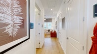 This contemporary 950 square foot apartment in Charlotte, NC offers a harmonious blend of style and functionality. The open-concept floor plan seamlessly integrates the living room and kitchen, creating an inviting space for both relaxation and entertainment. The gourmet kitchen boasts pristine white cabinetry, stainless steel appliances, and a spacious island with seating, perfect for casual dining or food preparation.

The apartment features two well-appointed bedrooms, including a primary suite of 160 square feet. Each bedroom is thoughtfully designed with ample closet space and large windows that flood the rooms with natural light. The three luxurious bathrooms are finished with modern fixtures and sleek surfaces, providing both comfort and elegance.

Throughout the apartment, warm wood flooring adds a touch of natural beauty and warmth. The living areas are adorned with carefully curated artwork and stylish furniture, creating a sophisticated ambiance. Ceiling fans and recessed lighting contribute to the overall comfort and modern aesthetic.

The apartment's design maximizes storage with built-in closets and cabinets, ensuring a clutter-free living environment. Large windows in every room offer abundant natural light and views of the surrounding area, enhancing the sense of spaciousness. With its combination of contemporary design, high-end finishes, and thoughtful layout, this apartment offers a luxurious urban living experience in the heart of Charlotte.