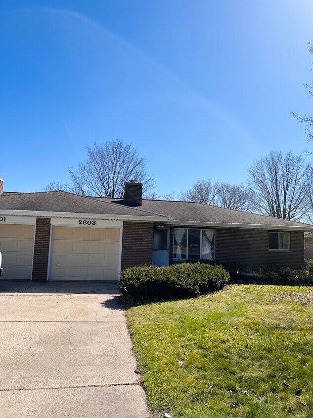 Street view of home with attached garage - 2803 Kochville Rd