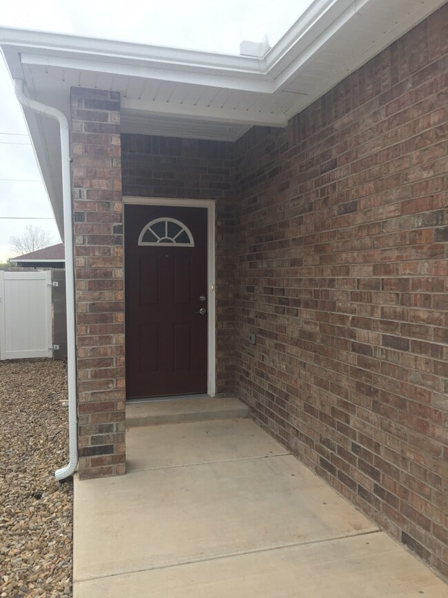 Front door w/backyard gate. - 2640 E 14th St