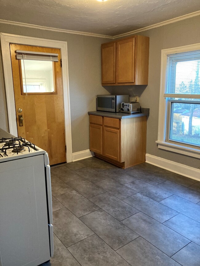 Kitchen with Back Stairwell (leads to basement & outside) - 311 N 60th St
