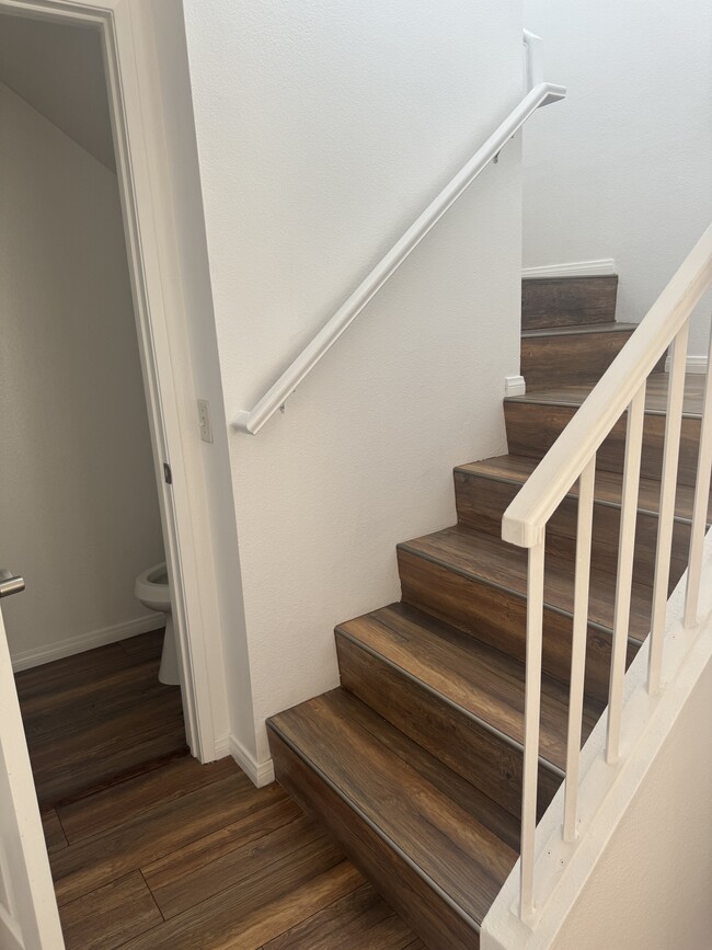 Staircase leading upstairs and guest bath - 25 Anacapa Ct