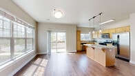 This well-designed two-story residence in Bend, Oregon, offers 1320 square feet of living space, thoughtfully distributed across four bedrooms and two bathrooms. The home's layout includes a laundry room, two hallways, and an open-concept kitchen and living area, creating a seamless flow for daily life.

The ground floor spans 690 square feet, while the upper level provides 630 square feet of space. The heart of the home is the modern kitchen, featuring light wood cabinetry, stainless steel appliances, and a substantial center island with a granite countertop. Pendant lighting adds a touch of elegance, complementing the overall contemporary design.

Large windows throughout the home invite ample natural light, creating a bright and airy atmosphere. The living areas boast warm wood flooring, enhancing the inviting ambiance. A fireplace in the living room adds both warmth and a focal point to the space.

The bedrooms are generously sized, with the primary bedroom offering a spacious 160 square feet. Plush carpeting in the bedrooms ensures comfort underfoot. The bathrooms feature practical designs with tile flooring and wooden vanities, while the laundry room is equipped with full-sized appliances for convenience.

Located at 515 Aurora in Bend, this home combines functionality with modern aesthetics, making it an ideal space for comfortable family living or entertaining guests.