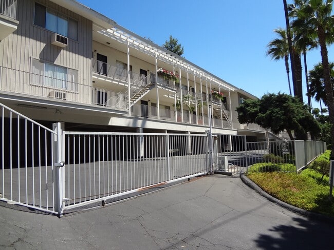Enterance gate at Villa Knolls Apartments in La Mesa, California. - Villa Knolls Apartments