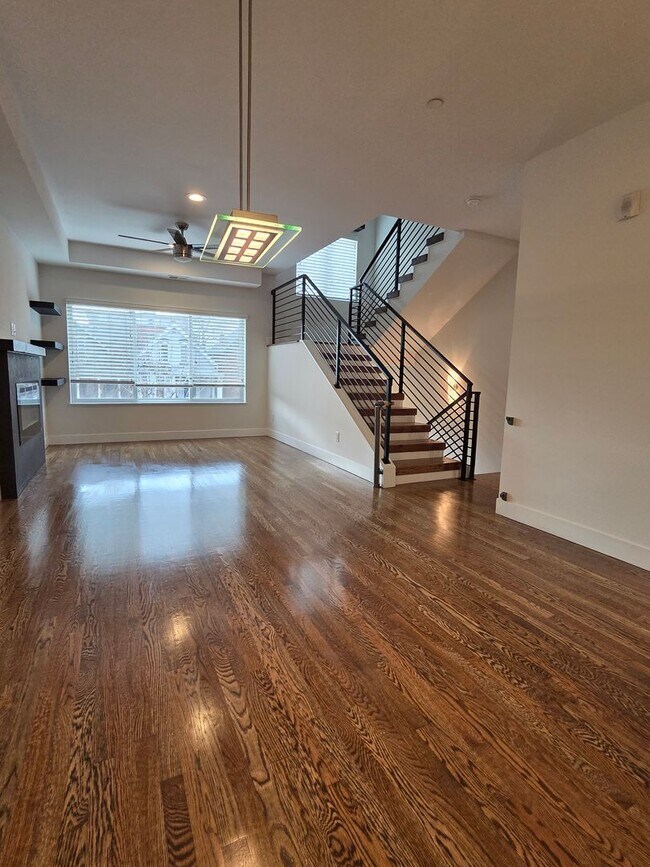 Building Photo - STUNNING 4-LEVEL TOWNHOME IN HIGHLANDS WITH SAUNA, 2-CAR GARAGE + AMAZING ROOFTOP DECK!