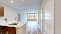 This contemporary 1080 square foot apartment offers a harmonious blend of style and functionality. The open-concept layout seamlessly integrates the living room and kitchen, creating a spacious feel ideal for both relaxation and entertaining. The kitchen is a highlight, boasting rich wood cabinetry, sleek stainless steel appliances, and a subway tile backsplash. A generous island with a quartz countertop provides additional prep space and casual dining options.

The apartment features two bedrooms, including a primary bedroom spanning 230 square feet, offering ample space for rest and relaxation. Both bathrooms are modern and well-appointed, with one featuring a glass-enclosed shower and built-in shelving for added convenience.

Throughout the apartment, warm-toned wood flooring adds a touch of elegance and continuity. Large windows flood the spaces with natural light, while neutral-toned walls create a blank canvas for personal décor. Ceiling fans in the bedrooms provide comfort and air circulation.

Storage is abundant with two closets and additional built-in shelving in various rooms. The apartment's thoughtful design extends to its layout, which efficiently utilizes every square foot of space. Located at 751 Vandenberg Road, this single-story dwelling combines modern amenities with practical living, making it an appealing choice for those seeking a contemporary urban lifestyle.