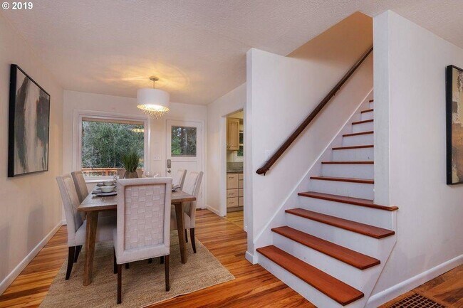 Dining room to upstairs - 7425 SW Canyon Ln