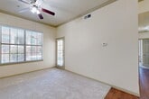 This 840 square foot apartment in Lewisville, TX, offers a well-designed living space with two bedrooms and two bathrooms. The single-floor layout maximizes efficiency, featuring a modern kitchen with stainless steel appliances, wooden cabinets, and ample counter space. The kitchen opens to a combined living and dining area, creating an open-concept feel.

The primary bedroom, measuring 150 square feet, provides a comfortable retreat. Both bedrooms feature plush carpeting and large windows with blinds, allowing natural light to flood the spaces. The bathrooms are equipped with modern fixtures, including a combination tub and shower in one, and vanities with storage.

Storage solutions are plentiful, with a walk-in closet and built-in shelving units. The apartment also includes a dedicated laundry area with a washer and dryer hookup. Hardwood-style flooring in the main living areas adds a touch of elegance, while the neutral color palette throughout allows for personalization.

The property's location at 940 FM-3040 E in Lewisville offers convenience and accessibility. This well-appointed apartment combines functionality and comfort, making it an ideal home for those seeking a compact yet efficiently designed living space.