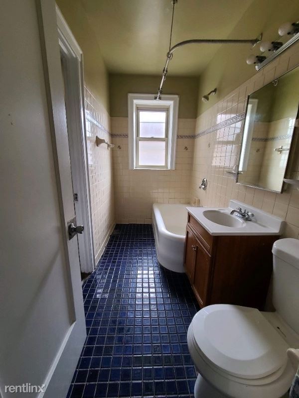 Building Photo - 2 br, 1 bath Apartment - 7147 S Cornell Ave