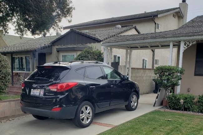 Parking in driveway with a carport - 215 N Myers St