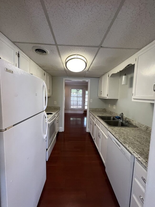 Building Photo - RENT SPECIAL! Just painted, modern gray! Charming end unit town home in Stones Throw. Walking dis...