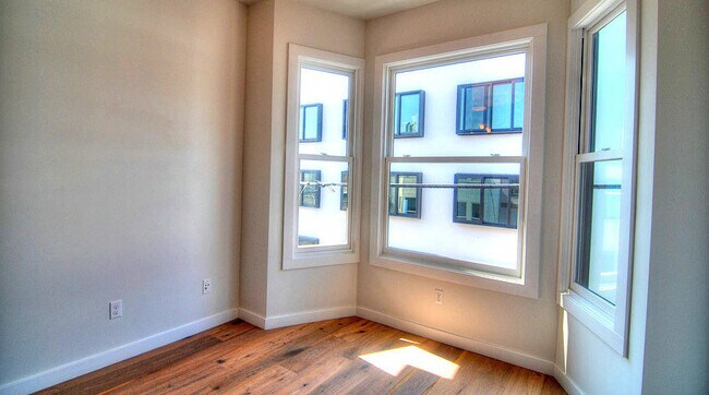Building Photo - Modern top floor 2 Bedroom plus office wit...
