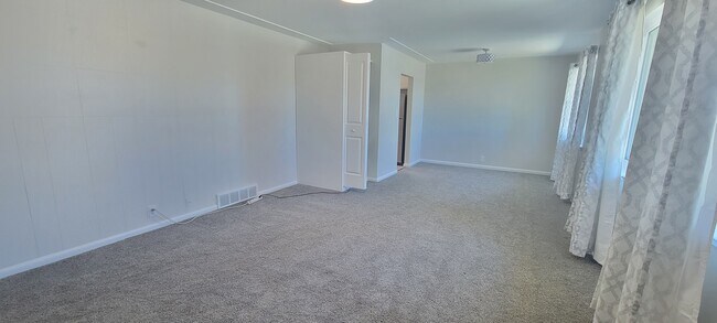 Living room/dining room with laundry closet - 5708 S Hickory Way