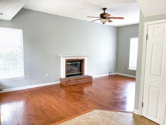 bright, large window ceils living room, wood fireplace - 102 Glouster Cir