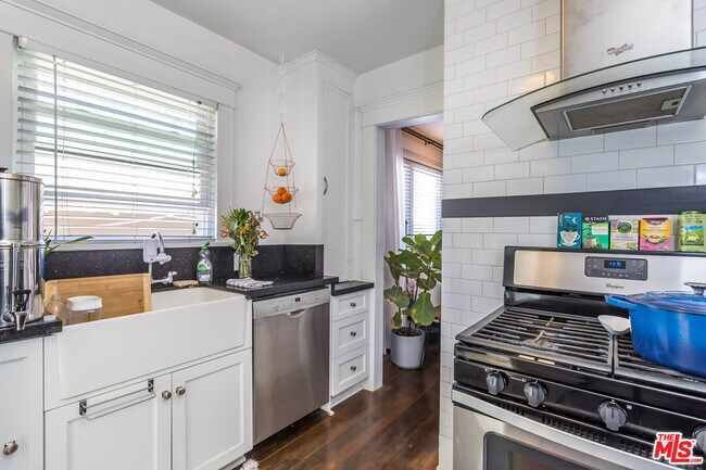 Modern kitchen with farmhouse sink and Bosch/Whirlpool appliances - 3606 Bellevue Ave