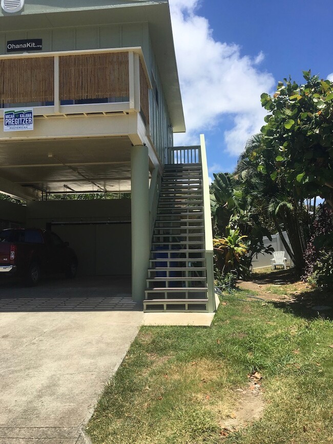 Entrance on side of side of main house. You have one covered parking in carport - 1131 Mokapu Blvd