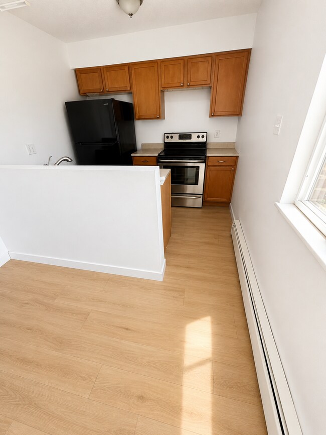 Photo - 2 bed 1 bath spacious living room area & updated finishes Apartment