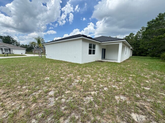 Foto del edificio - Modern 4-Bedroom Home in Poinciana – Get 5...