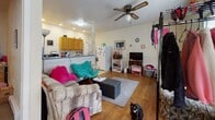 Located at 700 N Second St in Altoona, Pennsylvania, this single-floor unit offers a practical and straightforward layout across several connected rooms. The living area features warm hardwood flooring and is outfitted with a ceiling fan, recessed lighting, and windows that allow natural light to filter in. The space flows openly toward the kitchen, which is separated by a partial dividing column, creating a semi-open floor plan. The kitchen is equipped with warm-toned wood cabinetry, a tile-style countertop, an electric range, a full-size refrigerator, and in-unit washer and dryer hookups. Additional cabinet storage adds to the kitchen's functionality. The bedroom is carpeted and includes a built-in closet with bifold doors, offering practical storage. A ceiling light fixture illuminates the room. The bathroom features a bathtub, toilet, and baseboard heating, with white walls throughout. An electrical panel is accessible within the unit. The overall layout is compact yet functional, with hardwood floors in the main living areas transitioning to carpet in the sleeping quarters, providing a clear distinction between living and private spaces throughout this straightforward Altoona residence.