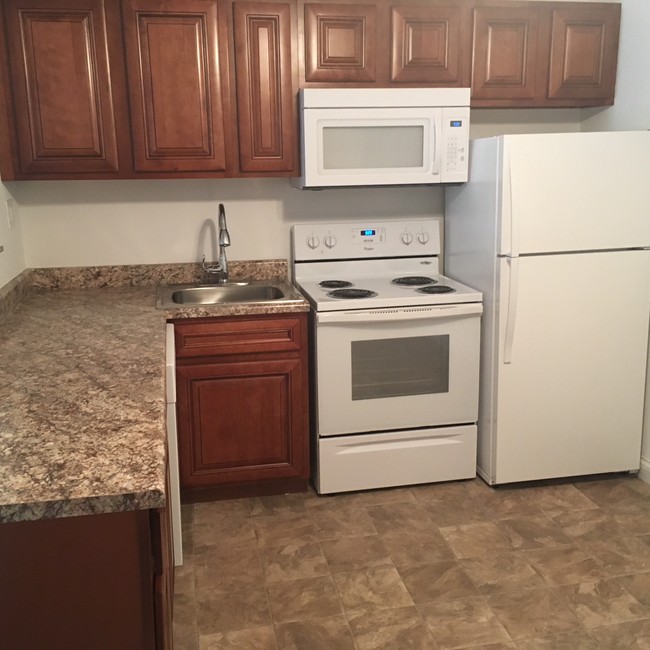 PARTIAL RENOVATED KITCHEN - Tuscany Village Apartments