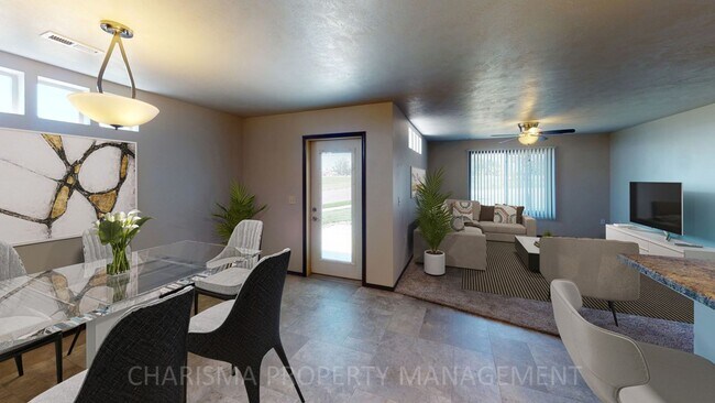 Building Photo - LOWER LEVEL 3 BEDROOM, 2 BATH TOWN HOME, INDIVIDUAL ENTRANCE, DOUBLE ATTACHED GARAGE, PET FRIENDLY