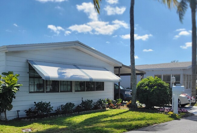 Beautiful updated 2-bedroom, 2-bathroom mobile home in the sought-after Palm Breezes Club community. - 3404 Seacoast St