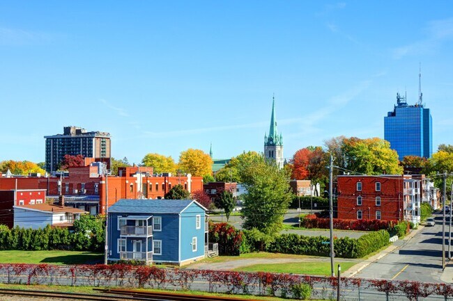 Downtown Trois-Rivières with fall colors and skyline.