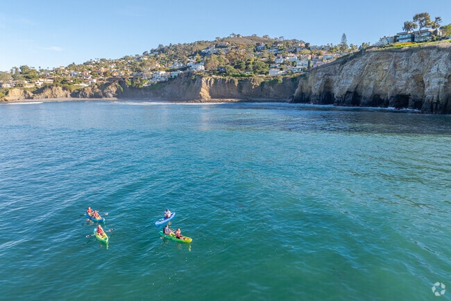 Kayakers enjoy the calm coastal waters of La Jolla Shores.