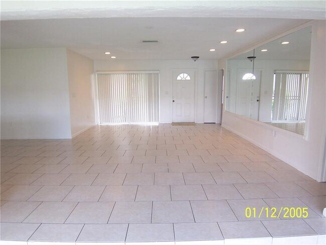 Living room, looking at entrance door - 9651 Sunset Strip