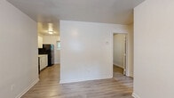 Located at 340 Dixie Hills Circle in Atlanta, GA, this efficiently designed one-bedroom, one-bathroom unit offers a practical and well-maintained living space. The interior has been updated throughout, featuring light-toned luxury vinyl plank flooring that extends across the main living areas and bedroom, lending a clean and cohesive aesthetic. Crisp white walls and flush-mount ceiling lighting keep the space feeling bright and neutral.

The open layout connects the living area directly to the kitchen, which is equipped with white cabinetry and black appliances, including a refrigerator and range. Natural light filters in through windows fitted with horizontal blinds, providing both brightness and privacy.

The bedroom is a well-proportioned space with the same updated flooring, a window overlooking greenery outside, and a dedicated entry door for privacy. A wall-mounted thermostat and ceiling vent ensure climate comfort throughout the unit.

The bathroom features a full soaking tub with a tiled surround in a neutral cream finish, a toilet, and a window that allows natural light into the space. The overall design is clean and functional.

This single-floor unit offers a straightforward, low-maintenance layout well-suited for individuals or couples seeking a comfortable home in the Dixie Hills community of Atlanta.