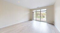Located in Milwaukee, WI 53212, this one-bedroom, one-bathroom unit offers a thoughtfully designed single-floor layout that maximizes every square foot. The open-concept living and kitchen area serves as the heart of the home, featuring light-toned luxury vinyl plank flooring and warm, neutral wall tones throughout. Large sliding glass doors in the living room flood the space with natural light and open directly onto a private balcony overlooking green outdoor surroundings — a standout feature that enhances the sense of openness and connection to the outdoors. The kitchen is well-appointed with white shaker-style cabinetry, dark countertops, stainless steel appliances including a refrigerator, range, microwave, and dishwasher, and tile flooring — providing ample storage and a clean, modern aesthetic. A peninsula counter separates the kitchen from the living area, adding functional workspace and a casual dining option. The generously sized primary bedroom features plush carpeting, a large window with exterior views, and convenient access to the rest of the unit. The full bathroom offers a single-vanity with white cabinetry, a combined tub and shower, and light wood-style tile flooring, maintaining the clean, cohesive design found throughout the home.